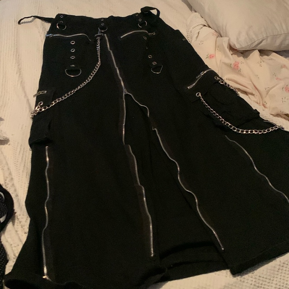 Full length unisex Tripp skirt. Four pockets. Chains, buckles etc.